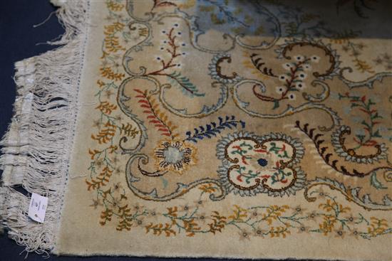 A Kashan cream ground five colour carpet, 15ft by 10ft 8in.